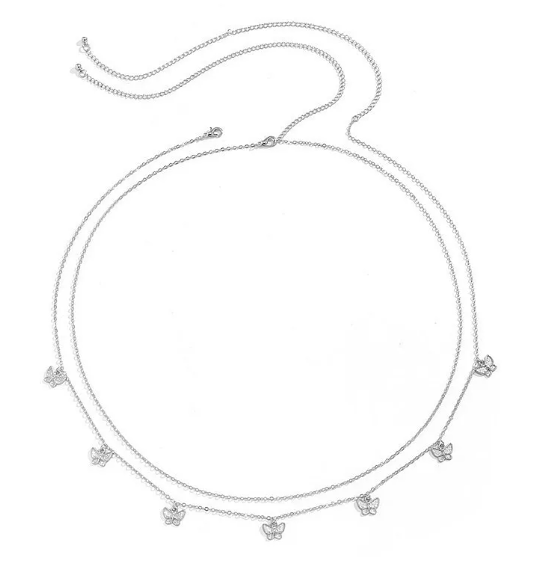 Silver necklace with small charms on a white background